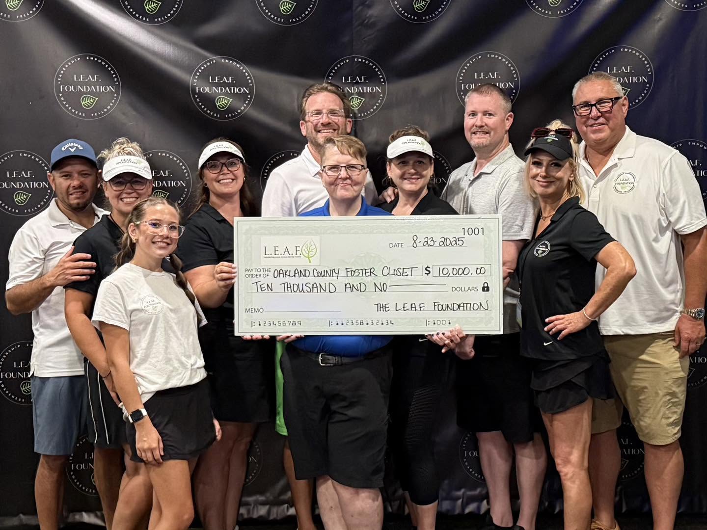 LEAF team presenting $10,000 check to Oakland County Foster Closet